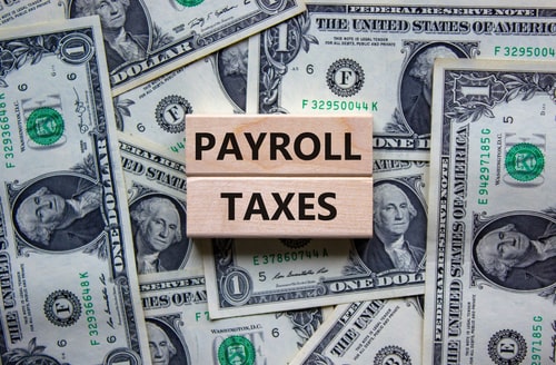 Payroll Taxes spelled out on blocks