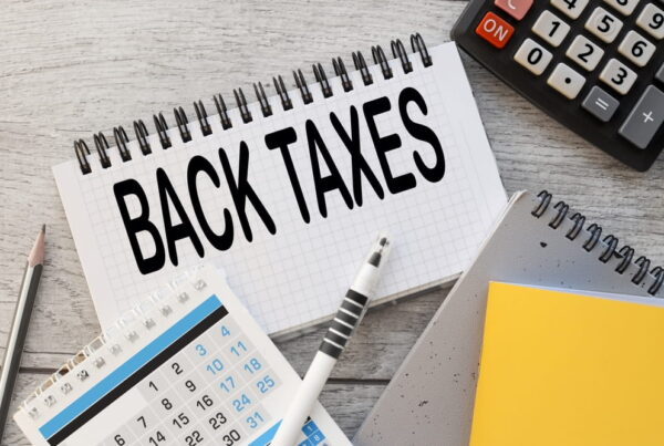 Back taxes written on notepad
