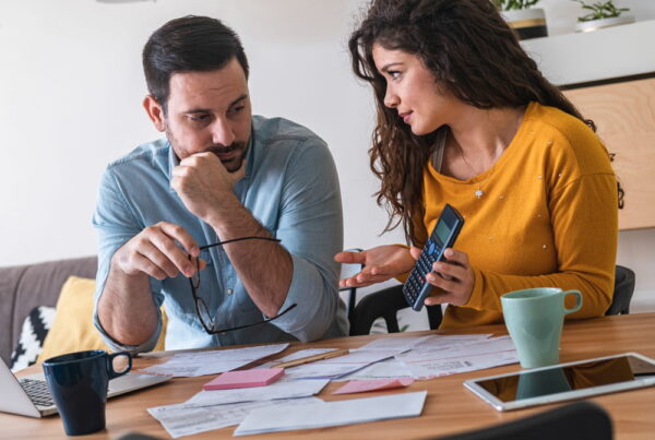 couple looking at back tax debt